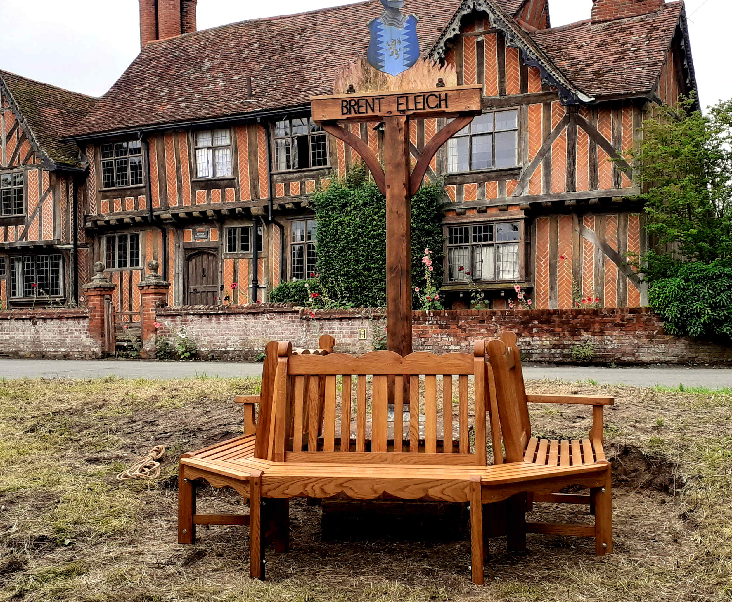 Bench and refurbished village sign